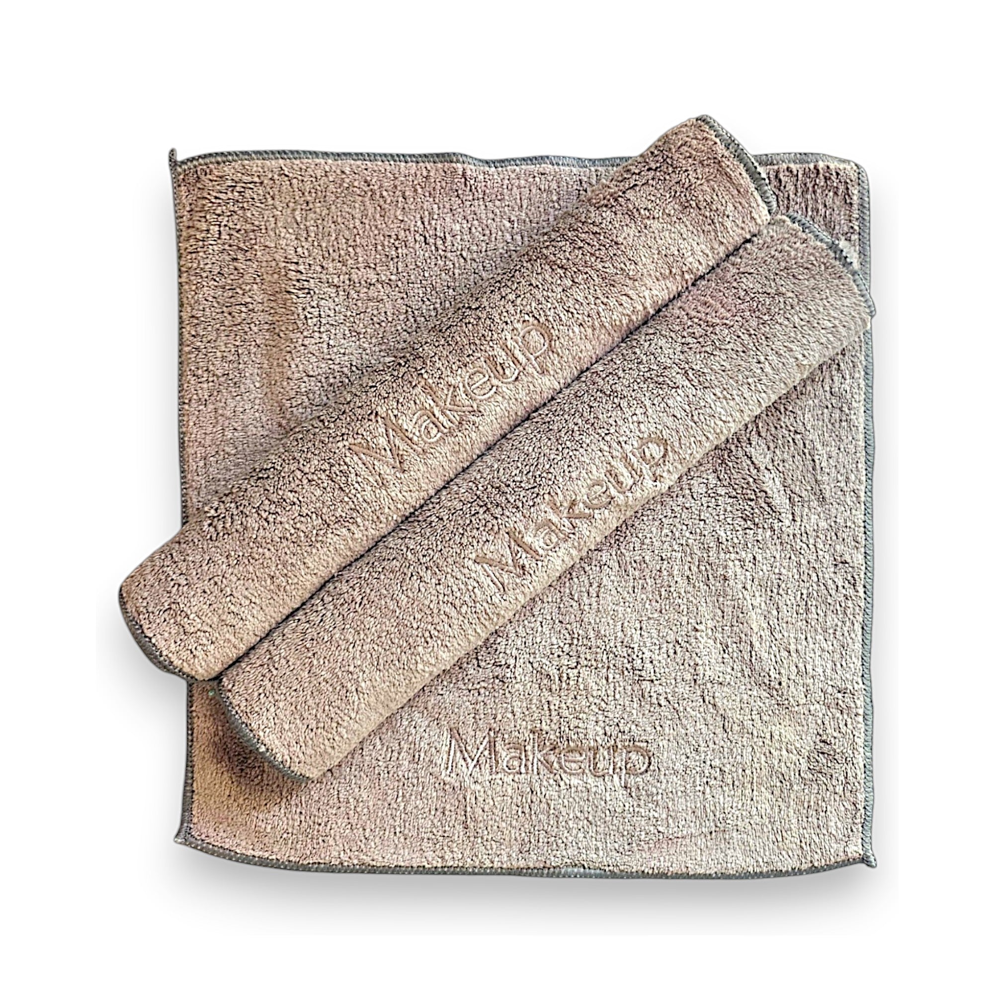 A soft, eco-friendly ESQ Skincare Clean Slate™ Microfiber Cloth in a neutral tone, neatly folded beside a skincare routine setup, highlighting its gentle, reusable, and sustainable design for effortless makeup removal. 🌿✨