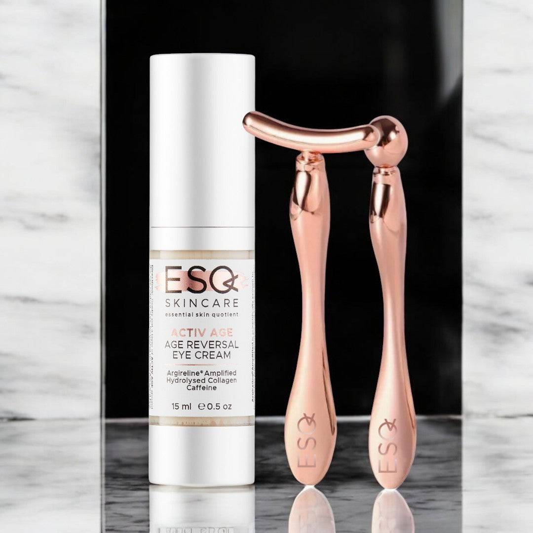 Eye Revive Luxury Gift Set featuring Argireline Amplified Age Reversal Eye Cream and rose gold face massage tools for reducing dark circles and puffiness.