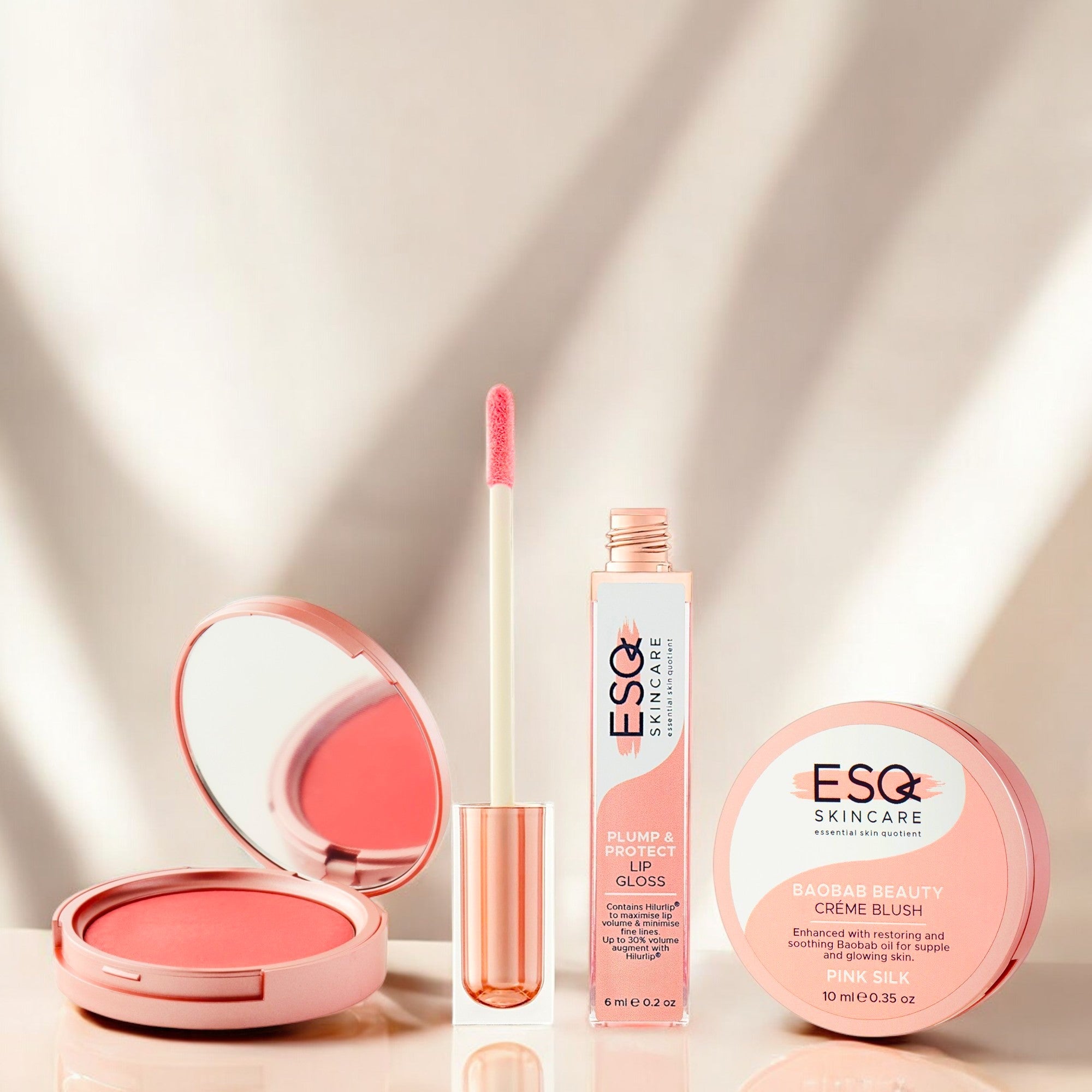 Glow On-the-Go Gift Set by ESQ Skincare featuring Baobab Beauty Crème Blush in Pink Silk and Plump & Protect Lip Gloss. Achieve a radiant, youthful glow anytime.