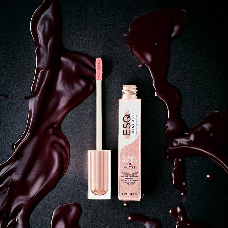 ESQ Skincare Plump & Protect Lip Gloss with hyaluronic acid for a hydrating, plumping effect. Luxurious rose gold packaging with rich, glossy texture.