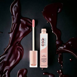 ESQ Skincare Plump & Protect Lip Gloss with hyaluronic acid for a hydrating, plumping effect. Luxurious rose gold packaging with rich, glossy texture.