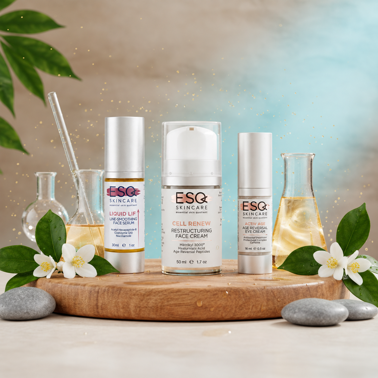 Three ESQ Skincare products displayed on a wooden tray with decorative leaves, flowers, glass bottles, and stones against a soft blue and beige background.