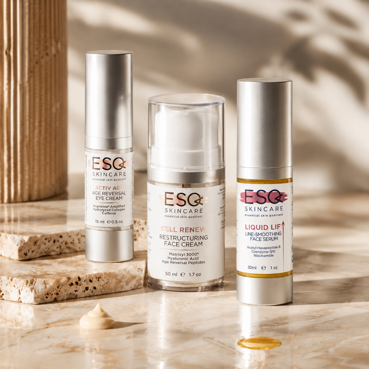 Three ESG Skincare products arranged on a marble surface with decorative stone props and soft shadow overlays: Activy Eye Serum, Cell Remin Restructuring Face Cream, and Liquid Lift Un-smoothing Face Serum.
