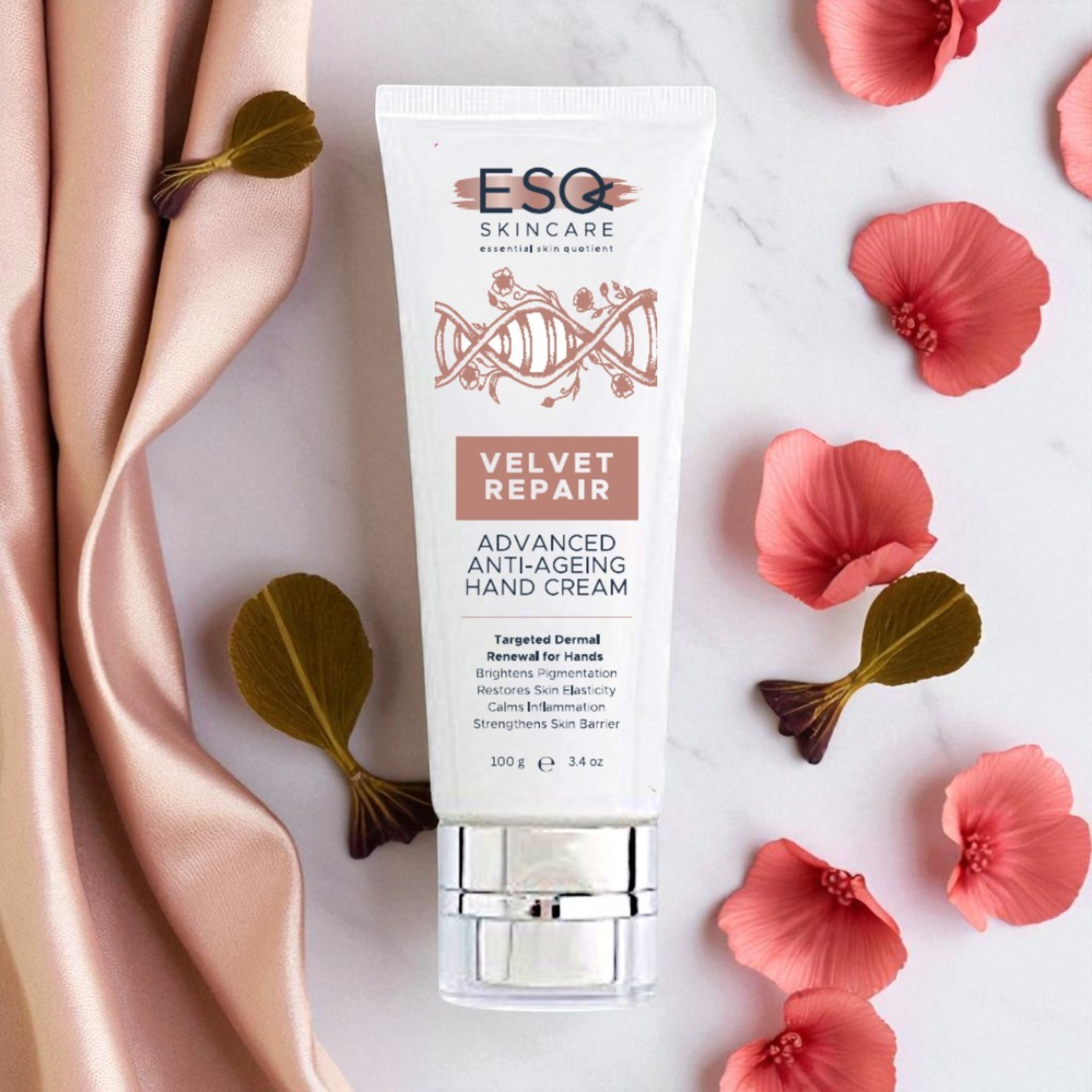 ESQ Skincare Velvet Repair hand cream with pink flowers and satin fabric on a light background