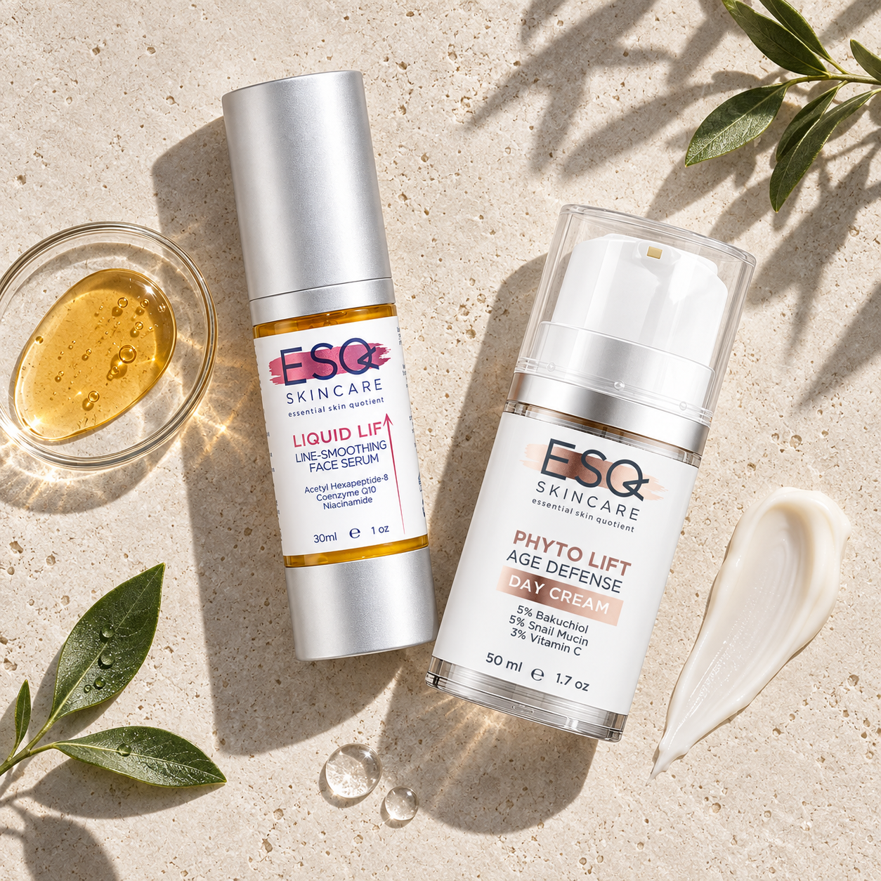 Two skincare products from ESC Skincare are displayed on a textured beige stone surface with natural leaves and a small glass of golden serum. The products are the Liquid Lift Line-Smoothing Face Serum and the Phyto Lift Age Defense Day Cream.