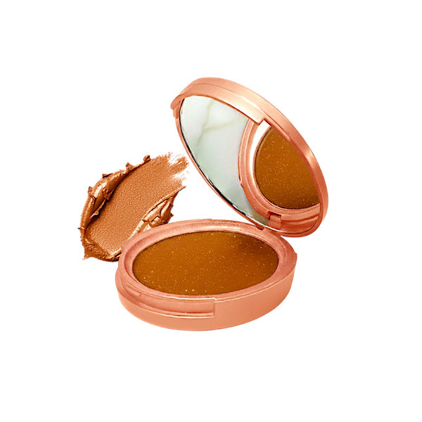 Open compact powder with rose gold casing and mirror on a white background