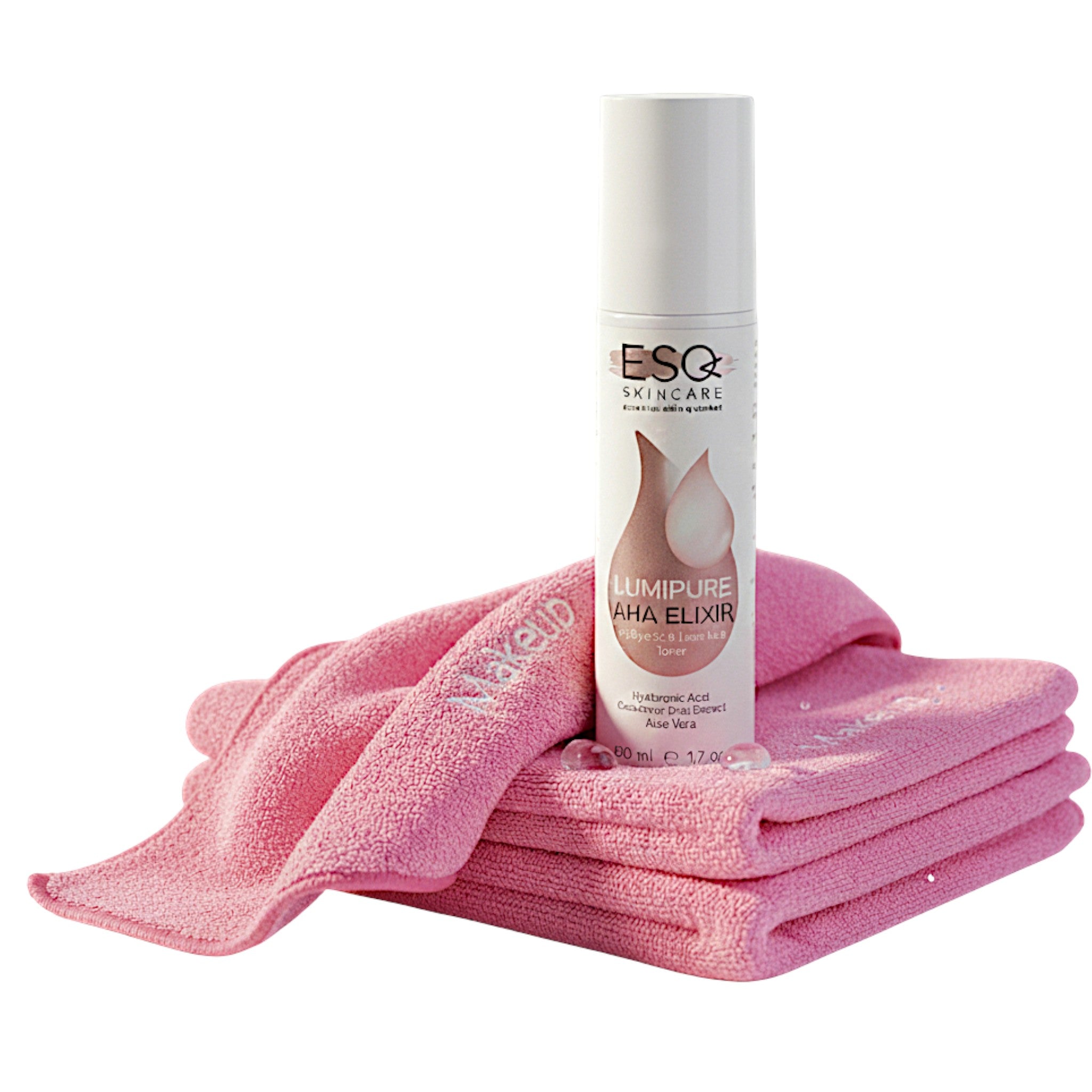 ESQ Skincare Lumipure AHA Elixir with pink towels on a white background