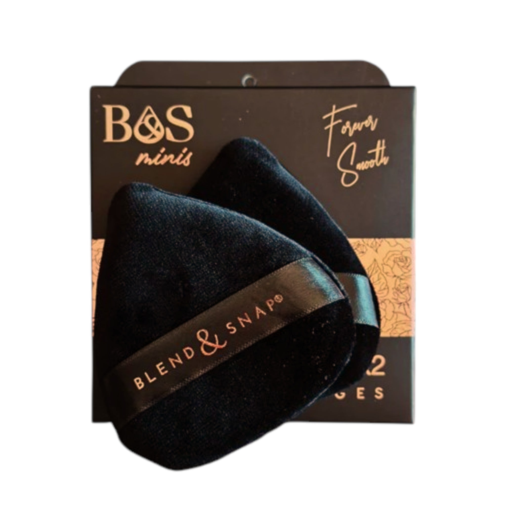 Black makeup sponge with 'Blend & Snap' branding on a branded packaging box.